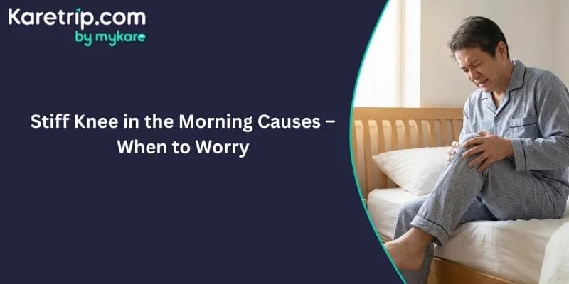 Man sitting on bed experiencing stiff knee pain in the morning